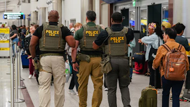 Three ICE agents in ATL airport.