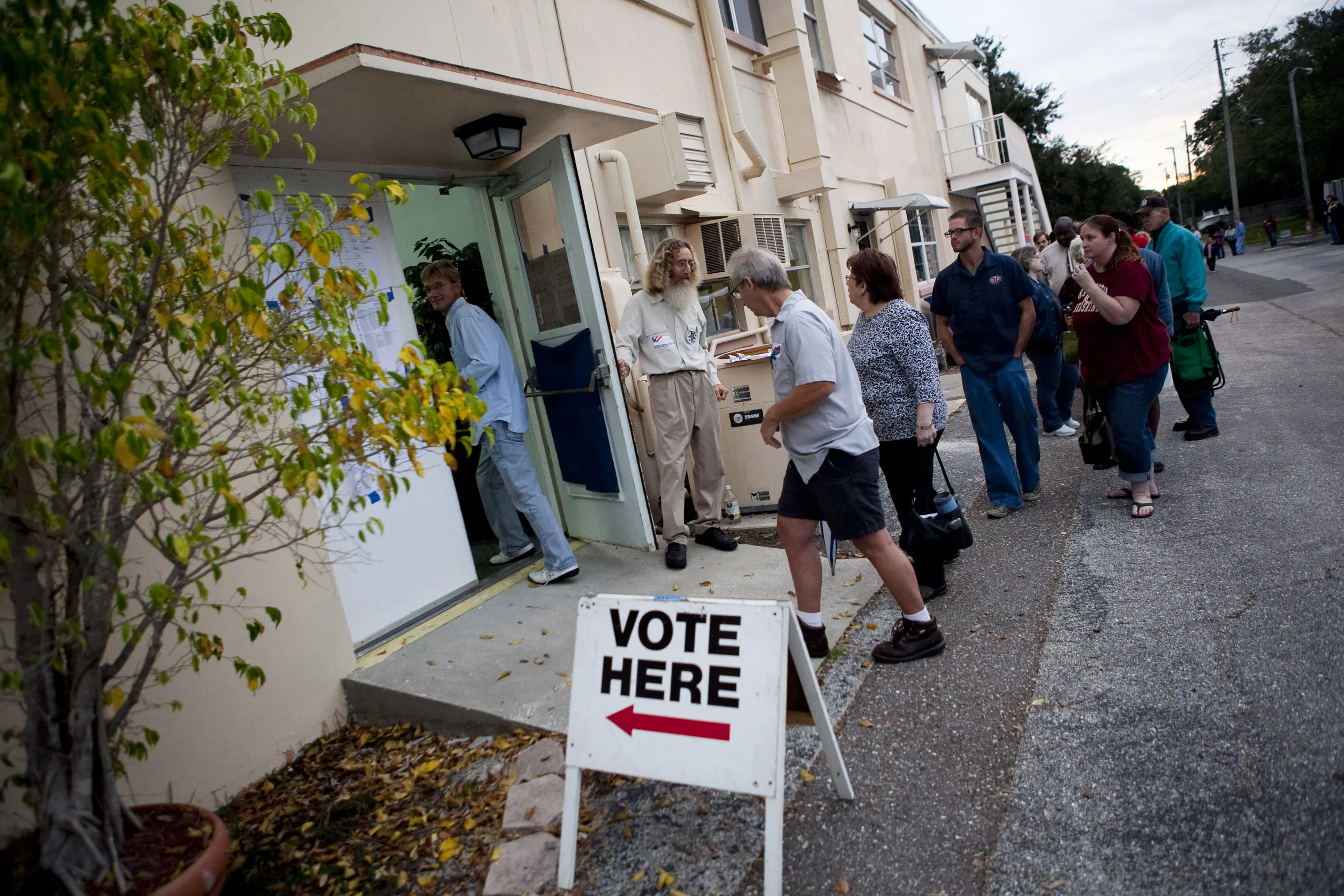 Lines of voters wait to cast their ballots.