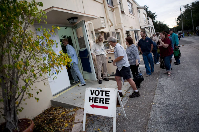 Lines of voters wait to cast their ballots.