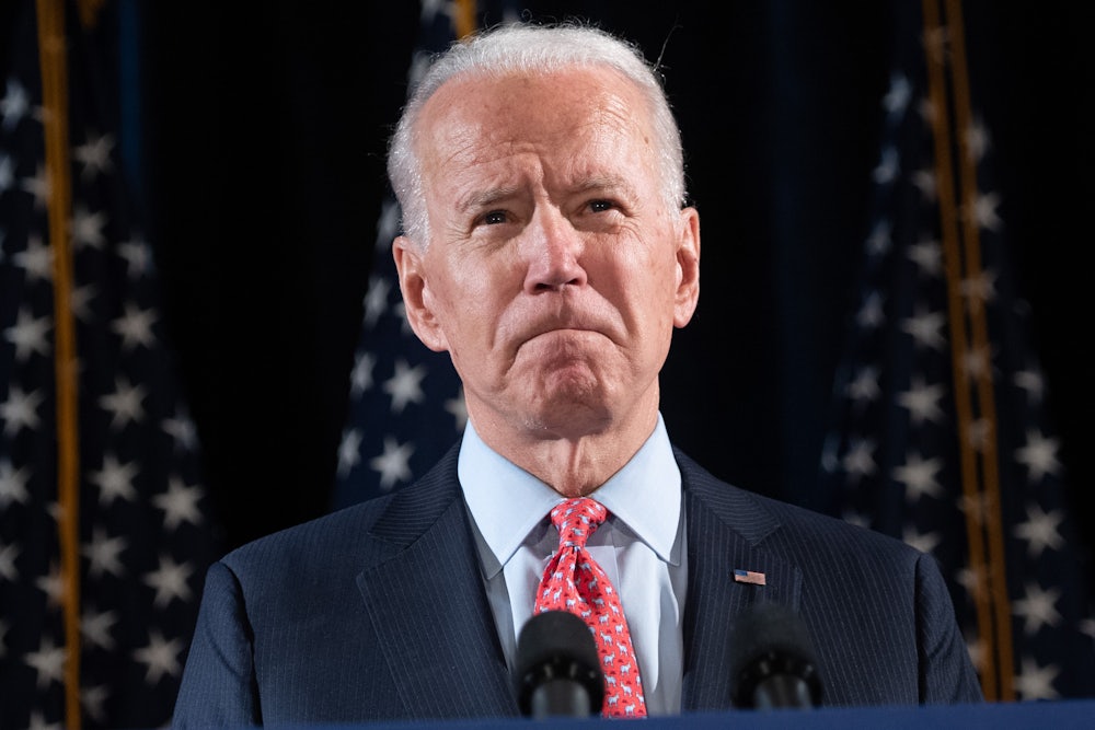 A close-up of President Joe Biden, grimacing.
