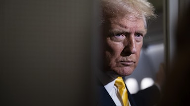 Donald Trump glowers aboard Air Force One