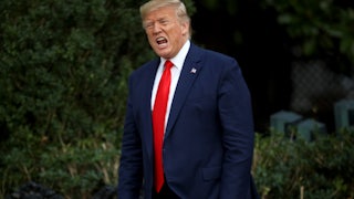 Donald Trump shouts at members of the media.