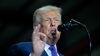 Donald Trump speaks at a podium