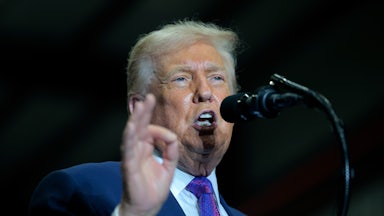 Donald Trump speaks at a podium