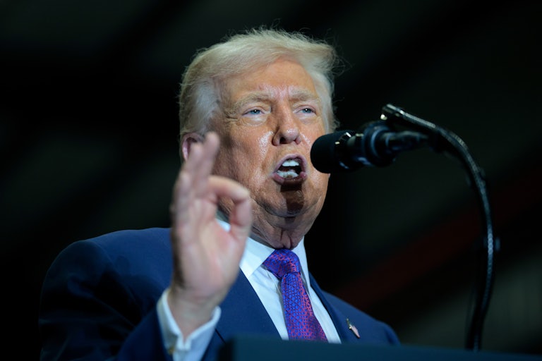 Donald Trump speaks at a podium