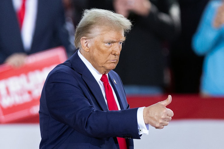 Donald Trump gives a thumbs-up during a campaign rally