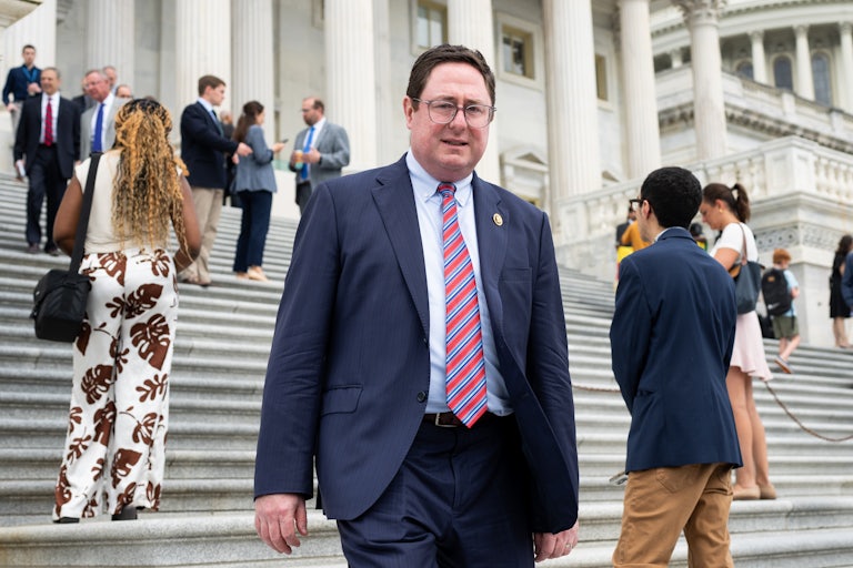 Representative Mike Flood walks down the Capitol steps
