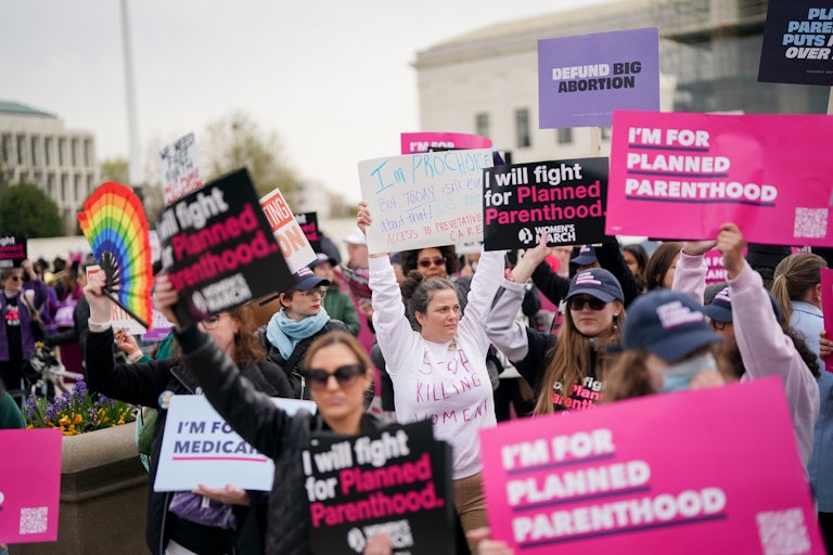 People protest in support of Planned Parenthood outside the Supreme Court in Washington, D.C.