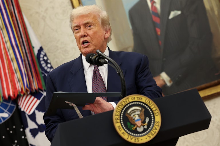 Donald Trump speaking at the presidential podium.