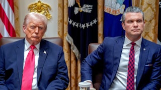 Donald Trump and Defense Secretary Pete Hegseth sit next to each other in a Cabinet meeting