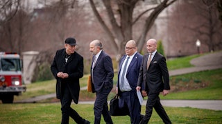 Musk walks and talks with Lutnick, Cheung, and Miller.