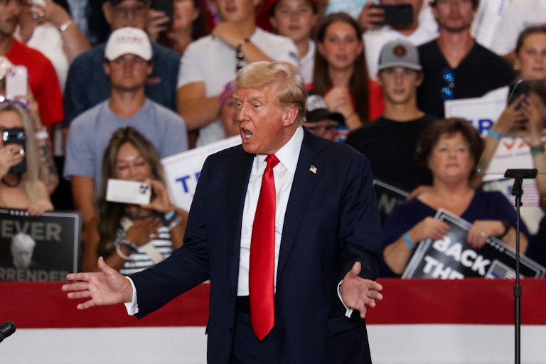 Donald Trump gestures as he speaks at a rally