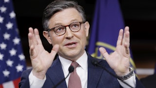 House speaker Mike Johnson makes a hand gesture while speaking to reporters