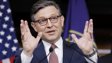 House speaker Mike Johnson makes a hand gesture while speaking to reporters
