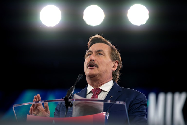 MyPillow CEO Mike Lindell speaks at a podium at CPAC