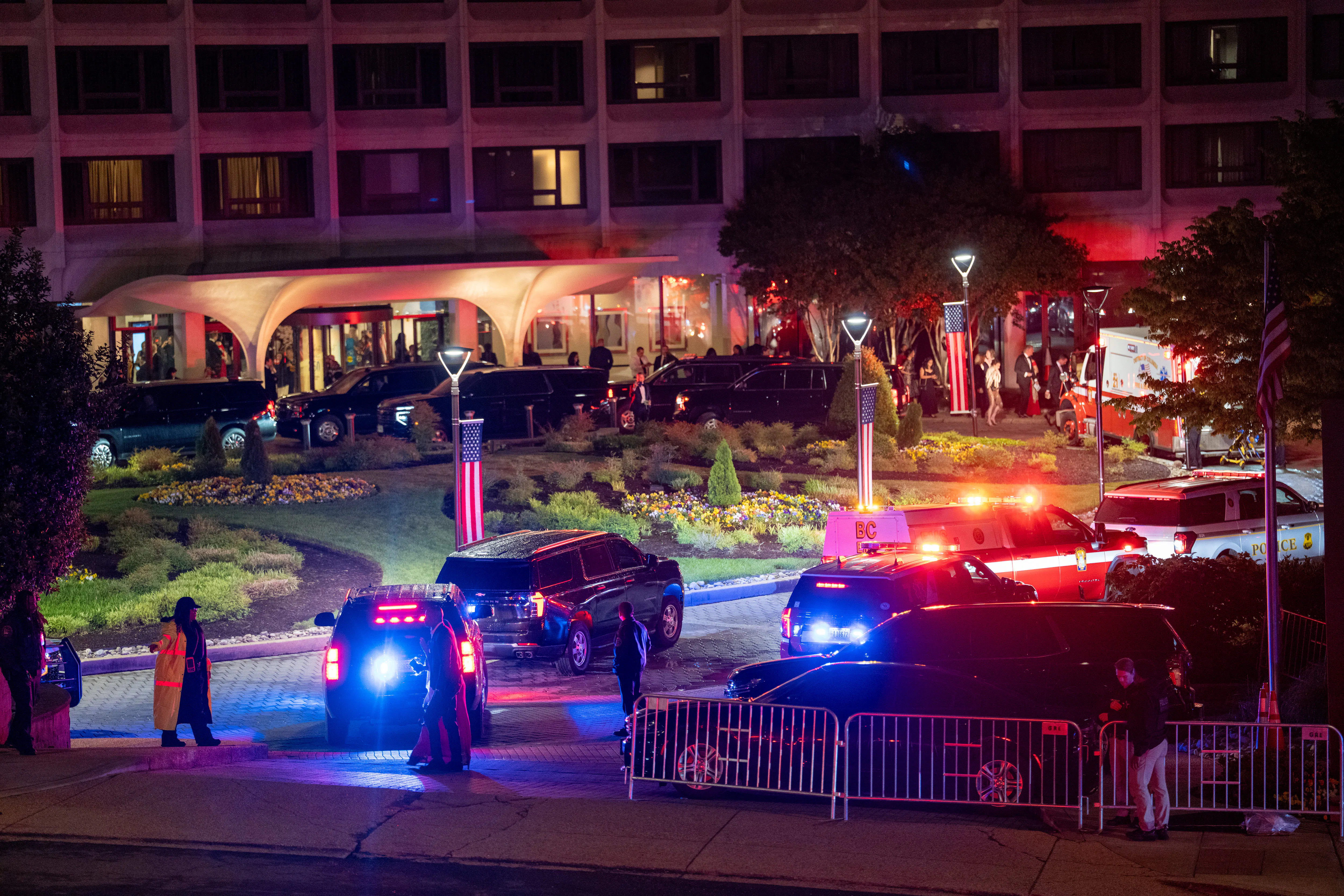 Law enforcement surrounds the Washington Hilton Hotel after shots were fired at the White House Correspondents' Dinner
