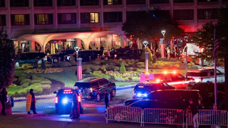 Law enforcement surrounds the Washington Hilton Hotel after shots were fired at the White House Correspondents' Dinner
