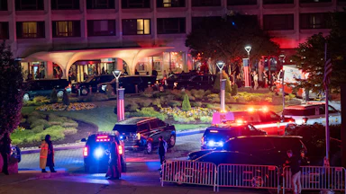 Law enforcement surrounds the Washington Hilton Hotel after shots were fired at the White House Correspondents' Dinner