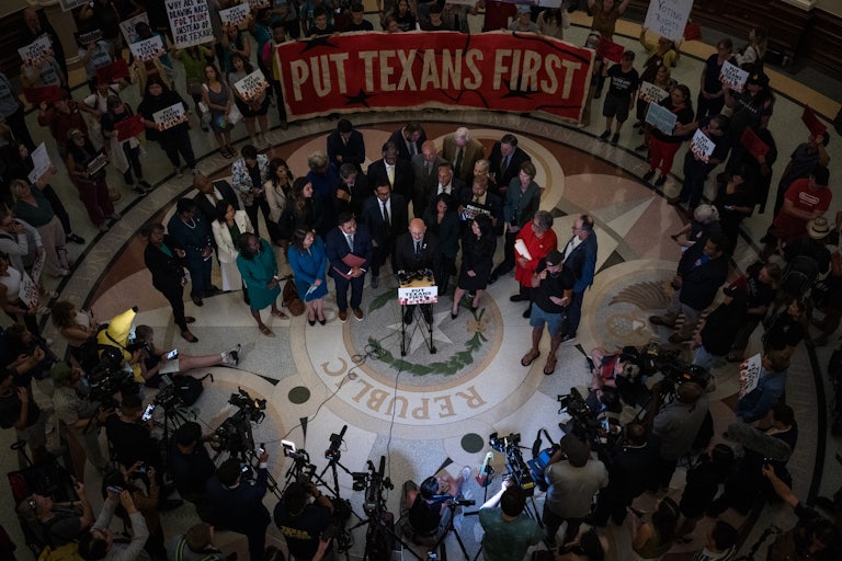 Texas Democrats speak at a press conference in the state Capitol after a redistricting vote