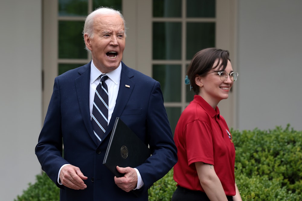 Joe Biden holds a mask and yells toward the press in the Rose Garden.