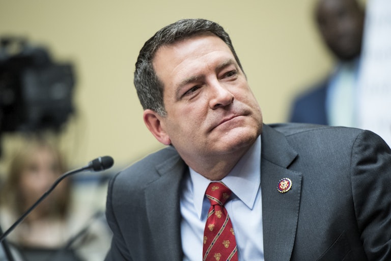 Representative Mark Green tilts his head during a House hearing.
