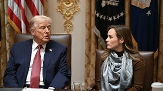 Donald Trump speaks to rice farmer Meryl Kennedy while sitting next to her at an agricultural roundtable