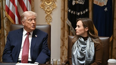 Donald Trump speaks to rice farmer Meryl Kennedy while sitting next to her at an agricultural roundtable