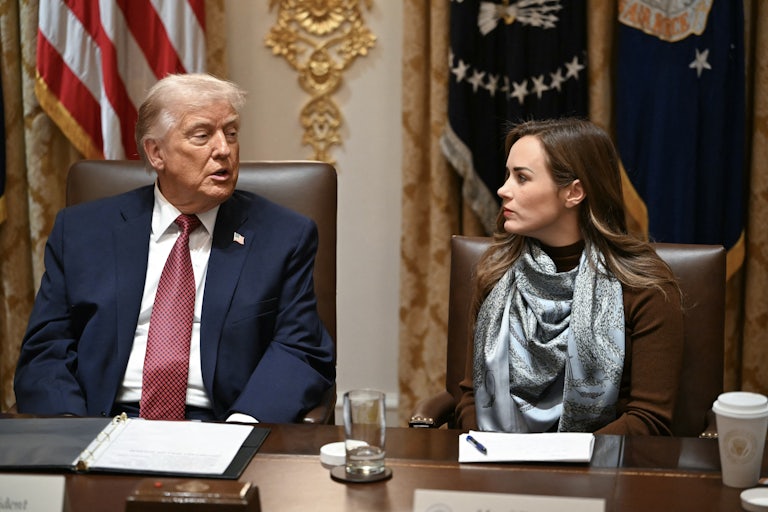 Donald Trump speaks to rice farmer Meryl Kennedy while sitting next to her at an agricultural roundtable