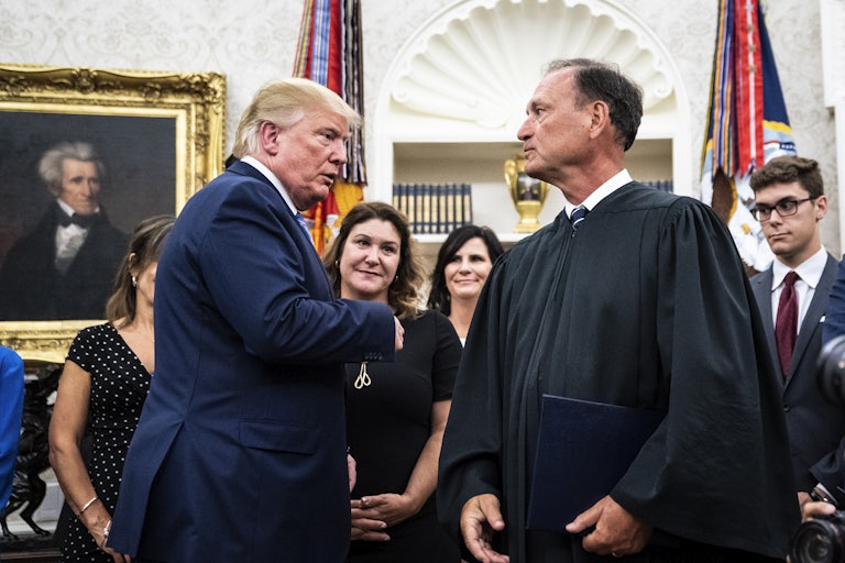 Donald Trump and Supreme Court Justice Samuel Alito in his robe.