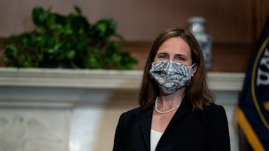 Justice Amy Coney Barrett sits for a meeting on Capitol Hill.