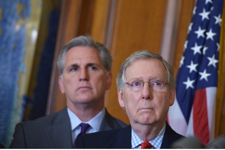 Republican leaders Mitch McConnell and Kevin McCarthy look on with their mouths closed