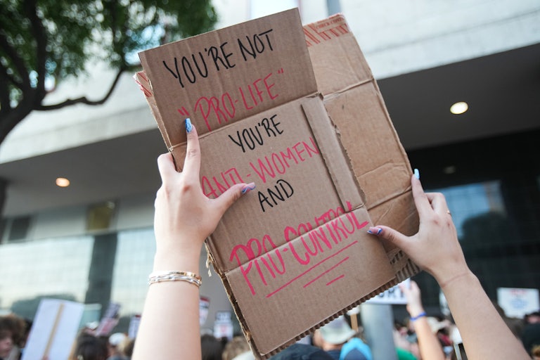 A person holds up a pro-abortion rights protest sign