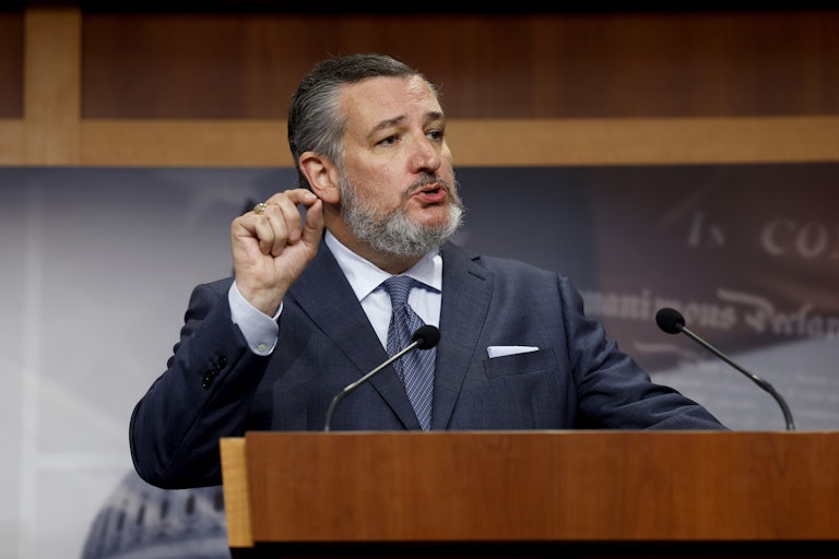 Ted Cruz talks at a podium and gestures with his hand
