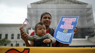 Olga Urbina and her son Ares Webster participate in a protest outside the US Supreme Court over President Donald Trump’s move to end birthright citizenship.