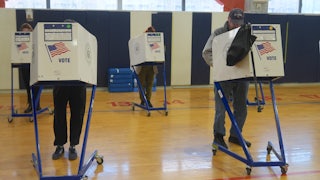 Voters cast their ballots at the polls.