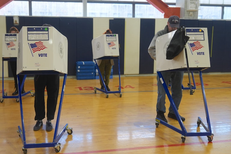Voters cast their ballots at the polls.