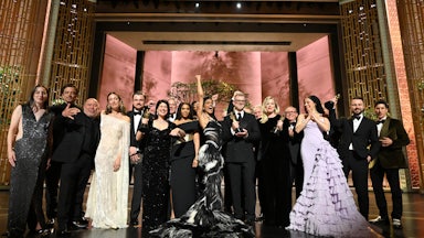 The cast and crew of Best Picture winner “One Battle After Another” pose backstage at the 98th Oscars, on March 15, 2026