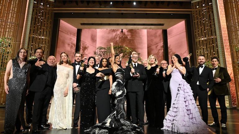 The cast and crew of Best Picture winner “One Battle After Another” pose backstage at the 98th Oscars, on March 15, 2026