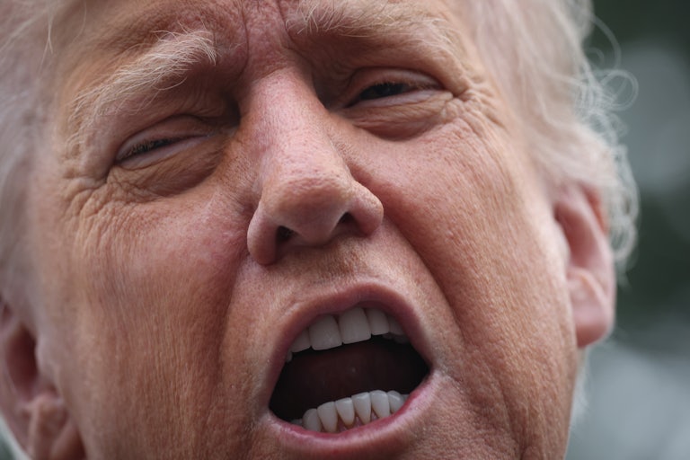 Donald Trump speaks to reporters outside the White House