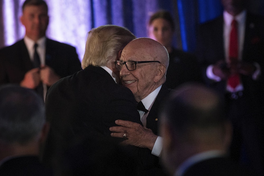 Trump and Rupert Murdoch embrace at a ceremony in New York