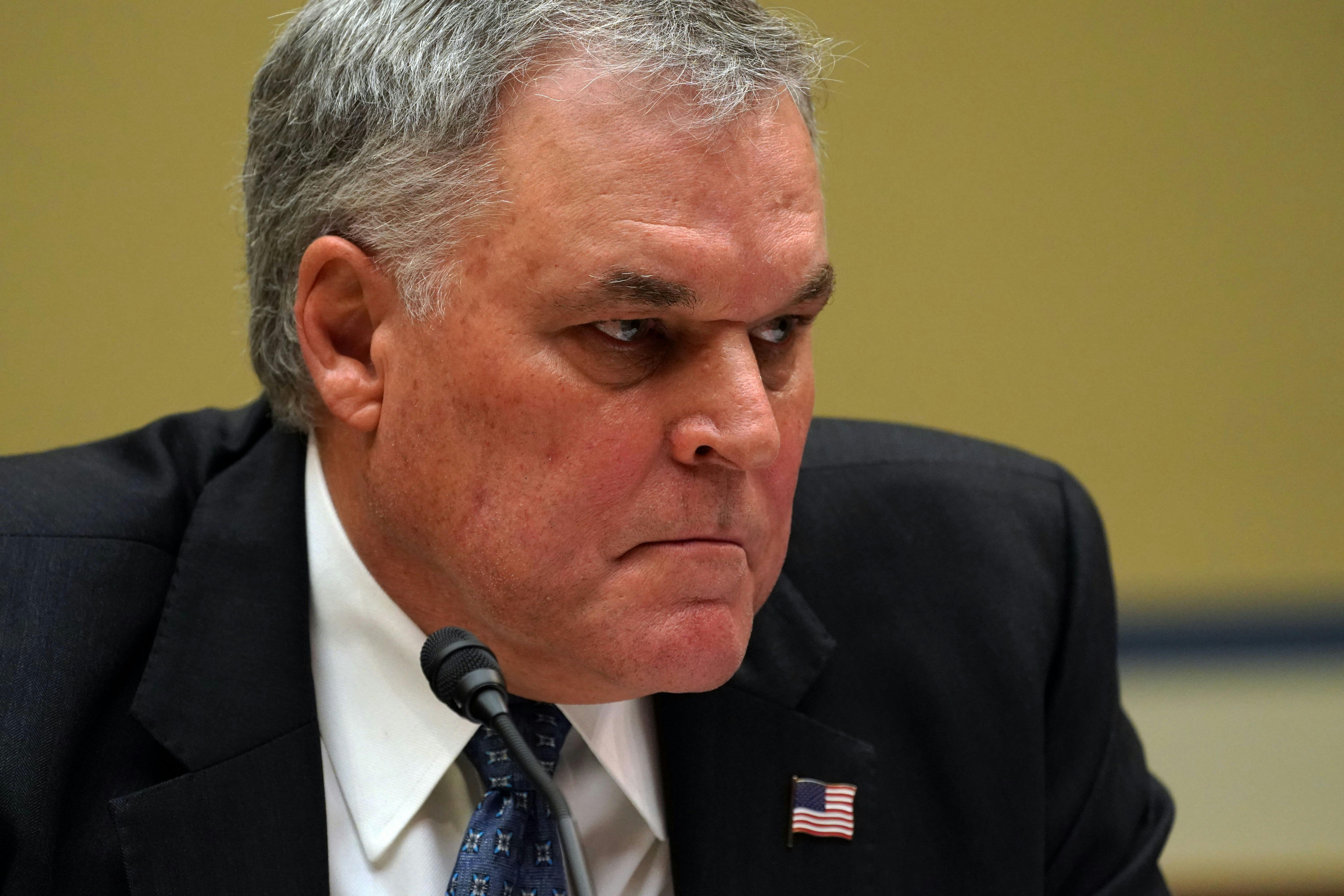 IRS Commissioner Charles Rettig grimaces during testimony before the House Oversight Committee.