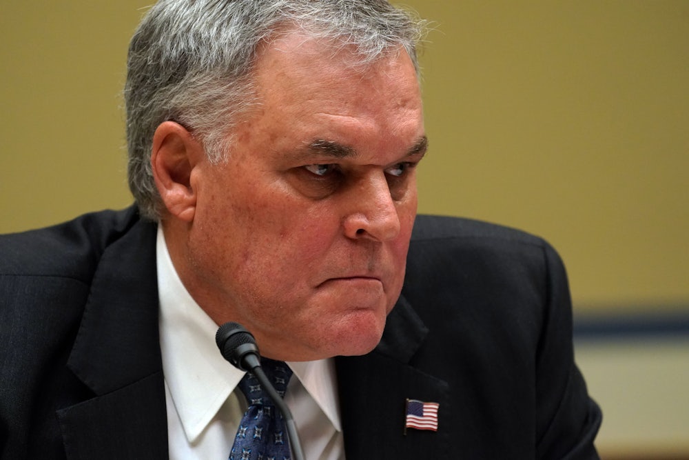 IRS Commissioner Charles Rettig grimaces during testimony before the House Oversight Committee.
