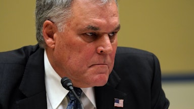 IRS Commissioner Charles Rettig grimaces during testimony before the House Oversight Committee.