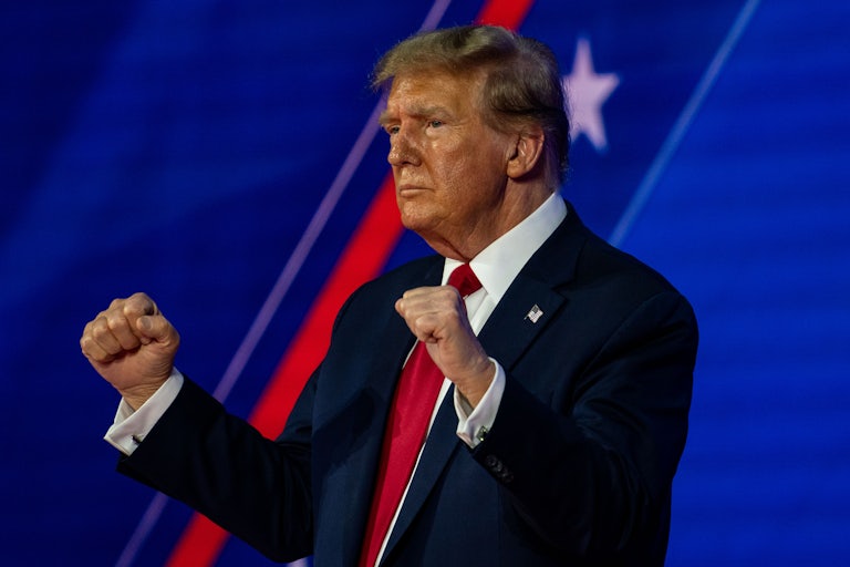 Donald Trump dances with his fists raised