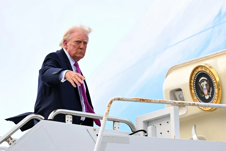 President Donald Trump boards Air Force One.