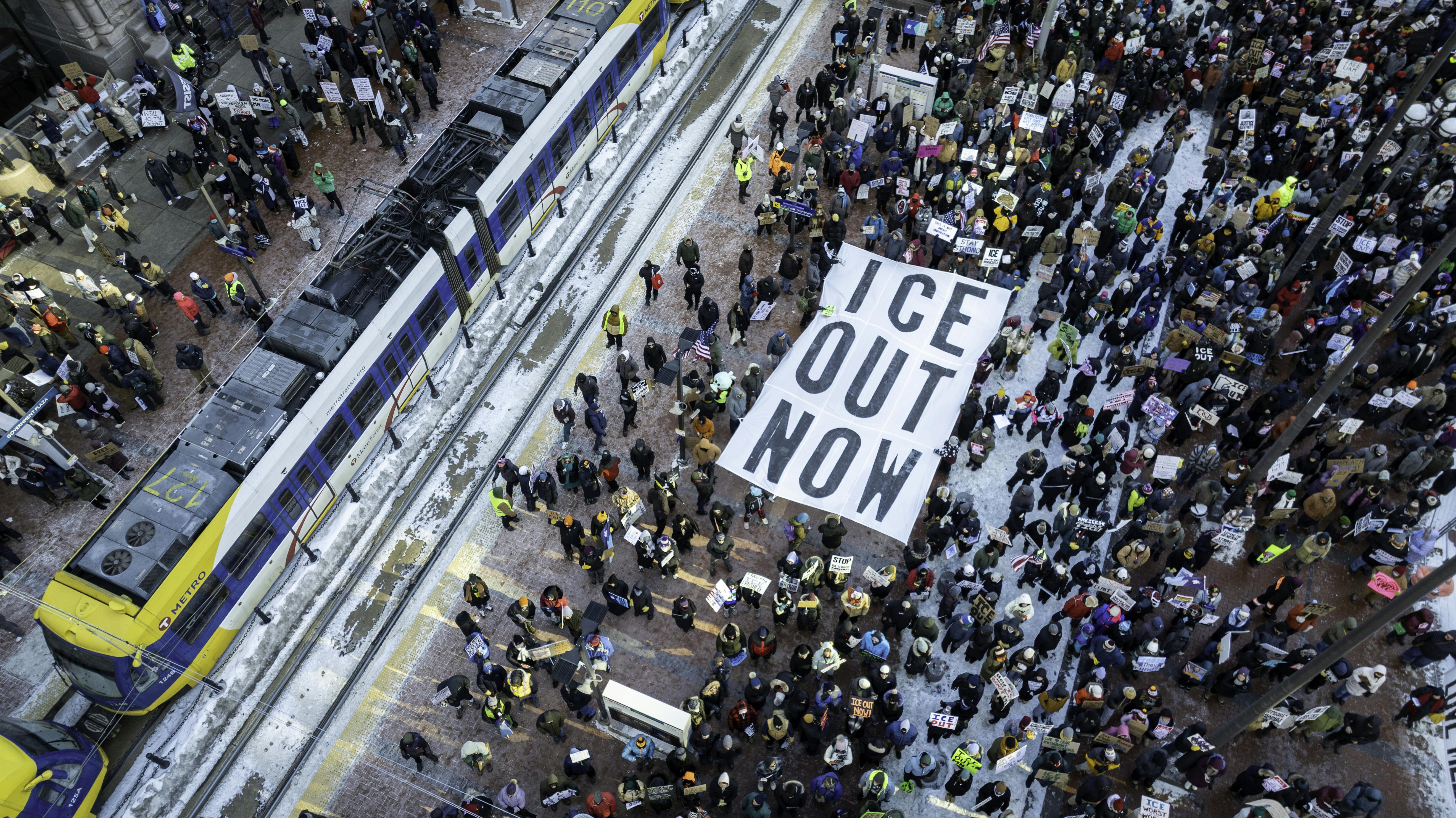 In an aerial view, demonstrators gather to march for an end to ICE operations in Minneapolis.
