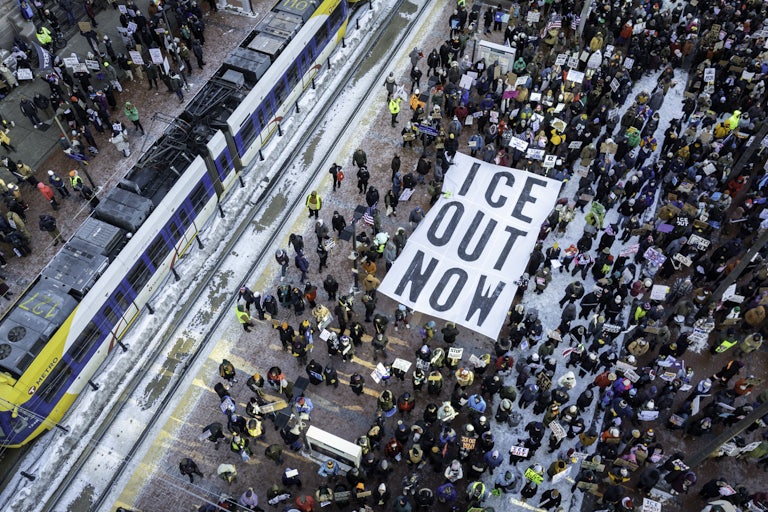 In an aerial view, demonstrators gather to march for an end to ICE operations in Minneapolis.