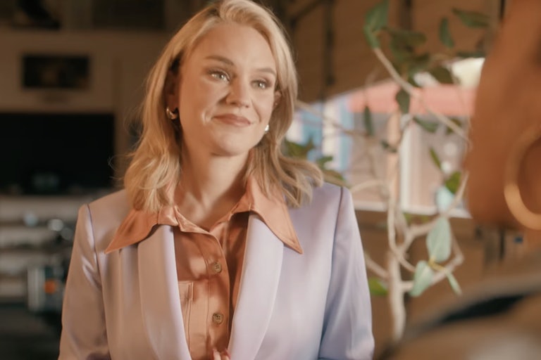 Aftyn Behn smiles as she listens to someone.