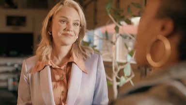 Aftyn Behn smiles as she listens to someone.