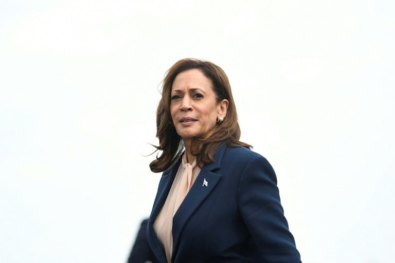 Kamala Harris walks on the tarmac at the Philadelphia airport